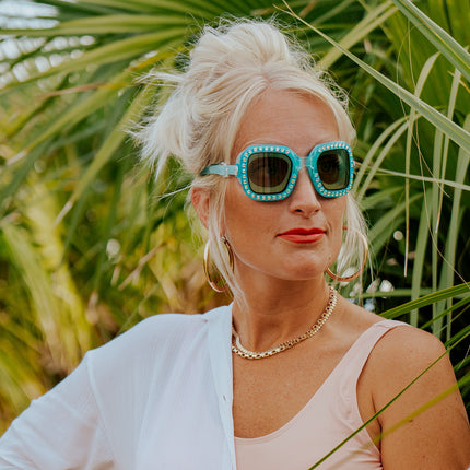 adult woman wearing vibrancy swim goggles in clear skies blue showing large square frame with rhinestones