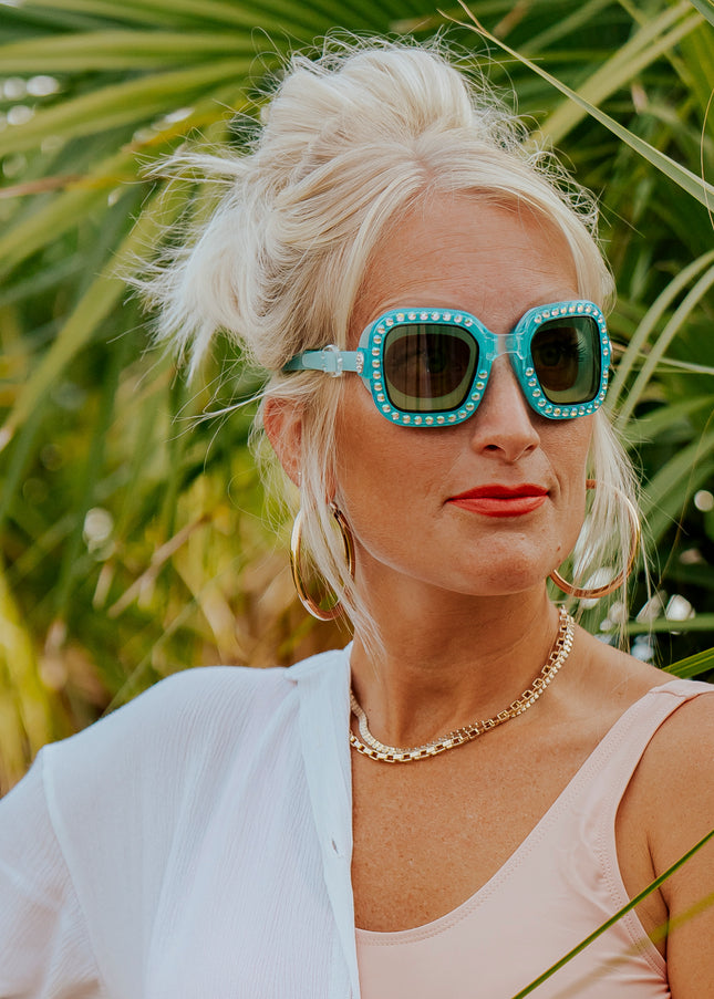 adult woman wearing vibrancy swim goggles in clear skies blue showing large square frame with rhinestones