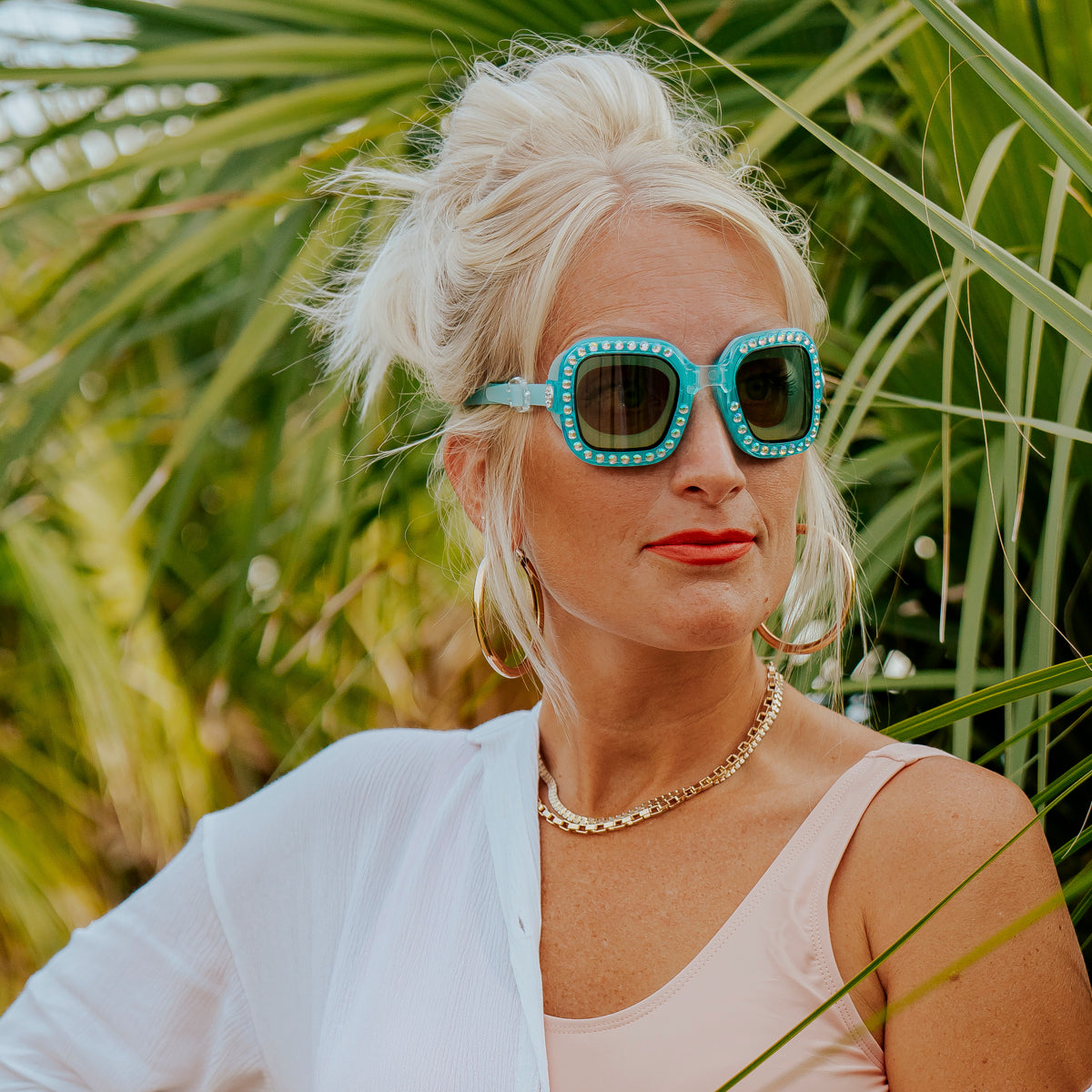 adult woman wearing vibrancy swim goggles in clear skies blue showing large square frame with rhinestones