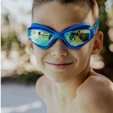 explore the pool kids swim goggles in freshwater lifestyle image of boy wearing freshwater swim goggles poolside