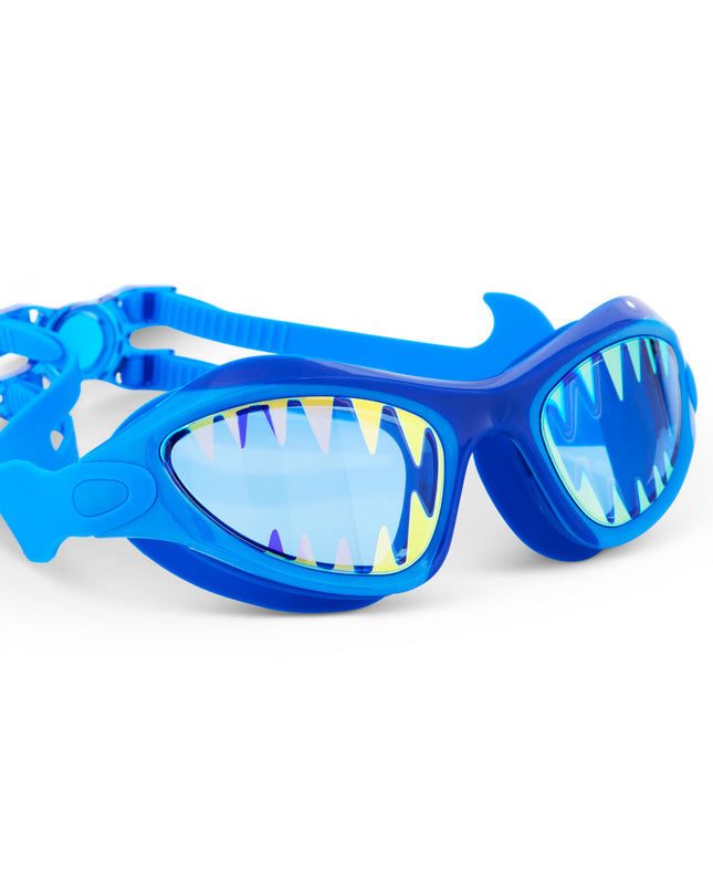 angled view of megamouth kids' swim goggles in riptide royal showing shark teeth screen printed on the lens on a blue wide frame