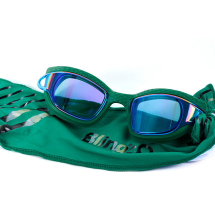 styled shot of Softline Swim Goggles in meadow showing textured frame, mirrored lens, and soft strap