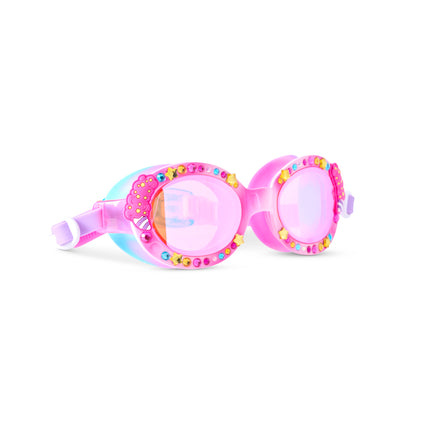 angled view of oval-shaped kids swim goggles in color pink parade featuring rhinestones, star gems, and cotton candy decals