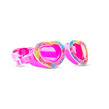 angled view of Crystal Crush Kids Swim Goggles in sugar kiss showing crushed rhinestone decor over a rainbow swirl frame