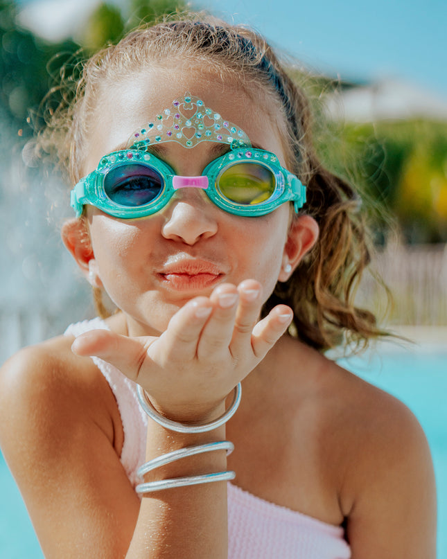 girl smiling posing wearing royal crown kids swim goggles in princess periwinkle showing crown and rhinestone details