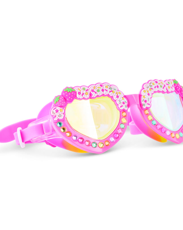 Angled view of Shortcake Strawberries & Cream swim goggles with strawberry details and rhinestones