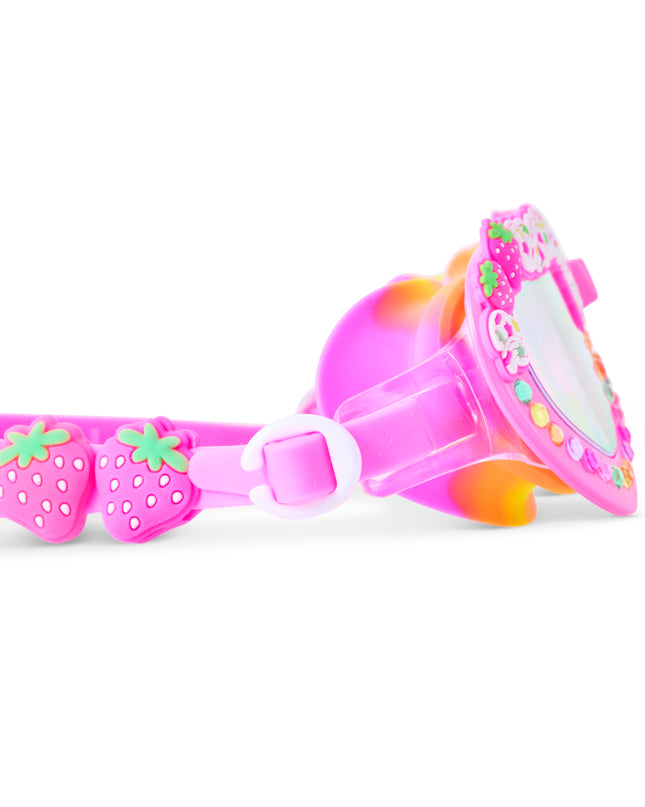Close-up of Shortcake swim goggles in Strawberries & Cream showing strawberry sliders, gems and trim detail