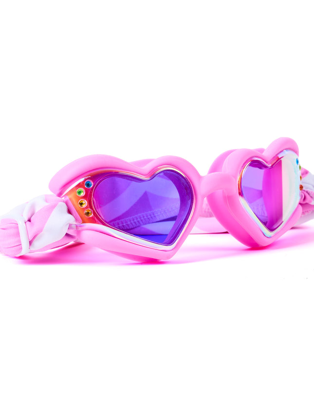 Angled view of Soft Crush Pink Wish swim goggles featuring glossy pink silicone heart frame, rhinestone details, mirrored lenses, and soft strap
