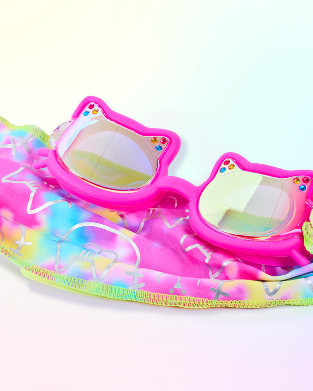Close-up glam shot of Soft Paws Fuzzy Pink goggles styled on matching pastel tie-dye soft strap, highlighting mirrored lenses, rhinestones, cat frame shape, and easy-on soft strap