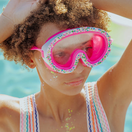 baked with love kids swim mask in pink pareils lifestyle girl wearing swim mask poolside