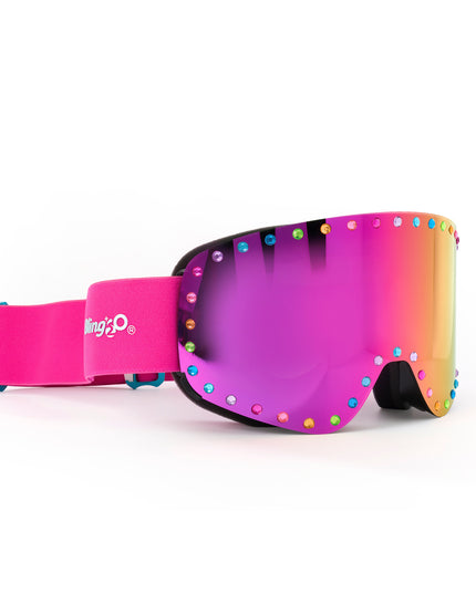 angled product image of powder pop ski goggles in alpen glow showing a ink mirrored lens with rainbow rhinestones and a hot pink strap