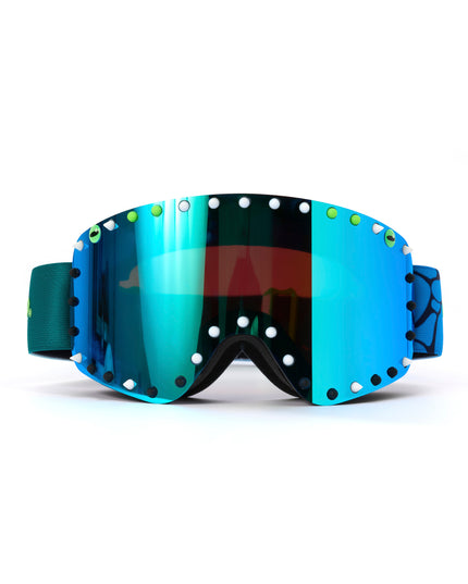 front angled shot of prism peak kids' ski goggles in glacier teal featuring a teal mirrored lens, blue strap, green, white and black silicone spikes with decorated monster eye on either side