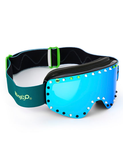 top angled shot of prism peak kids' ski goggles in glacier teal featuring a teal mirrored lens, blue strap, green, white and black silicone spikes with decorated monster eye on either side