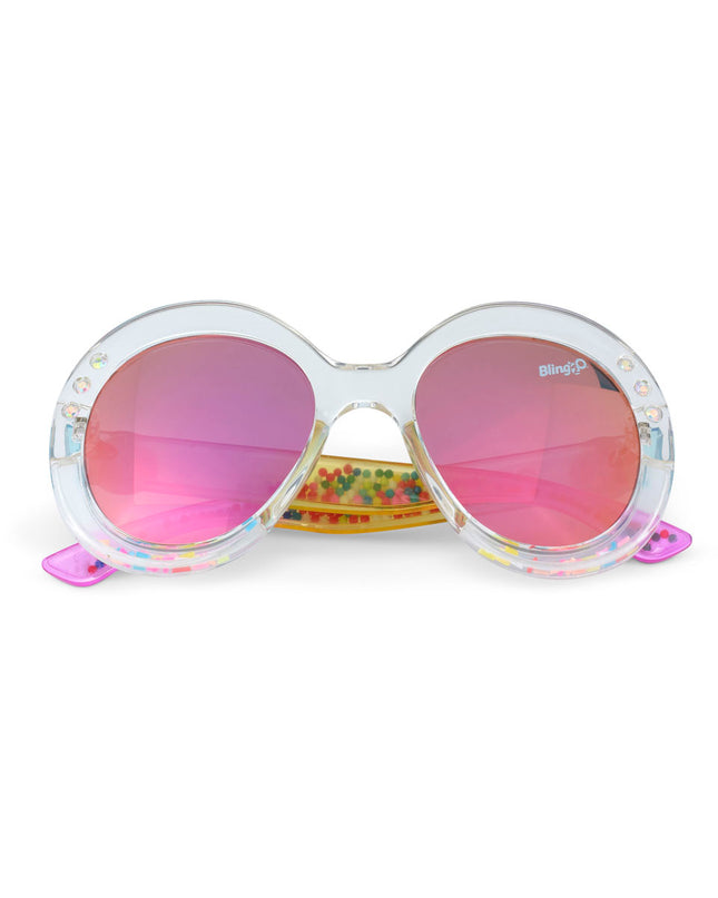 glass beach kids sunglasses in sprinkle sunrise showing reflective lens, clear large round frame with 3D gumballs in the arm of the sunglass
