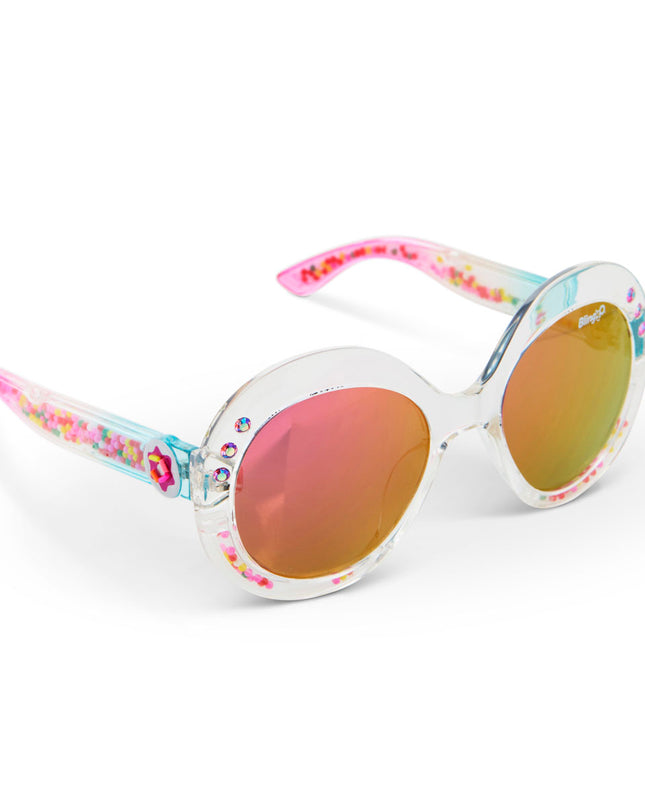 angled view of glass beach kids sunglasses in sprinkle sunrise showing reflective lens, clear large round frame with 3D gumballs in the arm of the sunglass