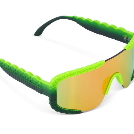 angled view of gulf shore kids' sunglasses in gator glare green showing gator textured arms and frame