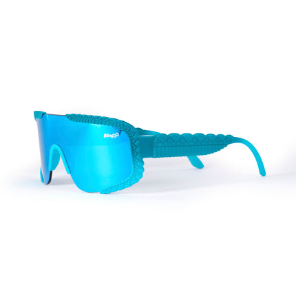 angled product shot of gulf shore kids' sunglasses in siesta sea featuring a vibrant blue color and crocodile-inspired texture