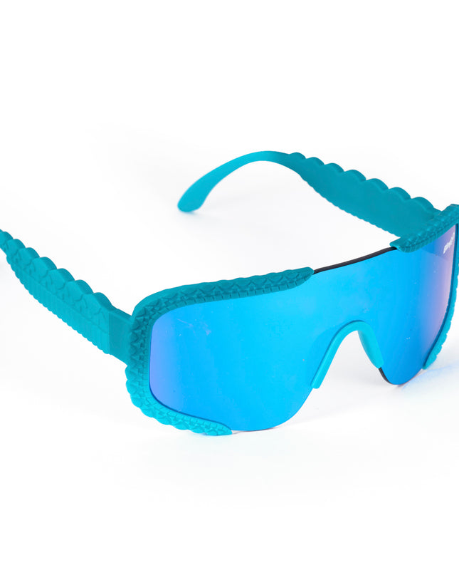 product shot of gulf shore kids' sunglasses in siesta sea featuring a vibrant blue color and crocodile-inspired texture