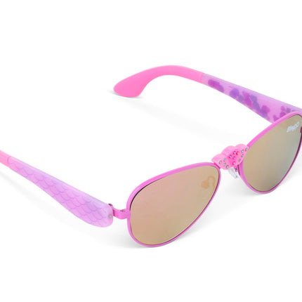 angled view of hampton beach sunglasses in bright bubblegum showing an aviator frame with mirrored lens and a crown nose piece and mermaid tail themed arms of sunglasses