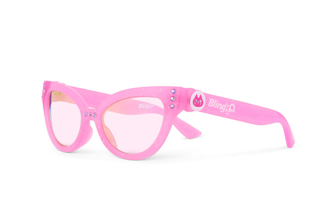 angled view of malibu beach kid's sunglasses in pisces pink to camera showing pink glitter frame and pink rhinestone detail