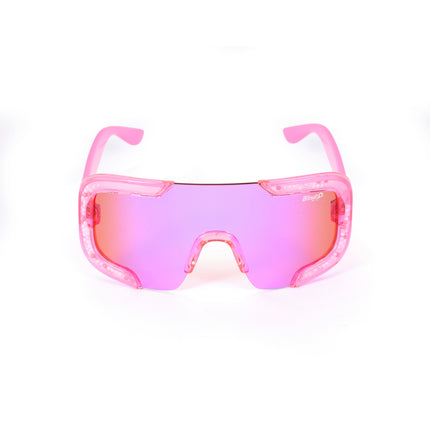 front product shot of pink sand kids' sunglasses in color sprinkle pink featuring shield frame with 3-d sprinkles in the frame, heart insignia and all pink frame and lens