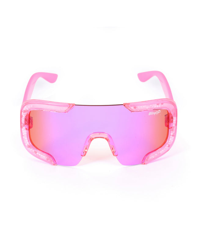 front product shot of pink sand kids' sunglasses in color sprinkle pink featuring shield frame with 3-d sprinkles in the frame, heart insignia and all pink frame and lens