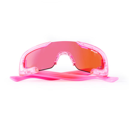 folded product shot of pink sand kids' sunglasses in color sprinkle pink featuring shield frame with 3-d sprinkles in the frame, heart insignia and all pink frame and lens