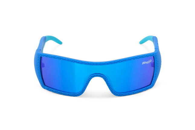 front view of sand harbor kids' sunglasses in sky blue stegosaur showing a sleek frame and dino texture