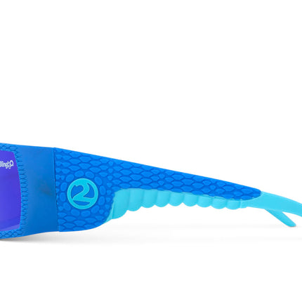 side view of sand harbor kids' sunglasses in sky blue stegosaur showing a sleek frame and dino textured arm of sunglass
