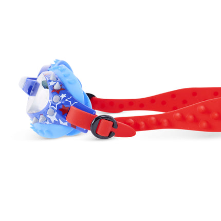 close-up view of prehistoric times kids' swim goggles in prehistoric and proud showing silicone spikes and stars printed on frame