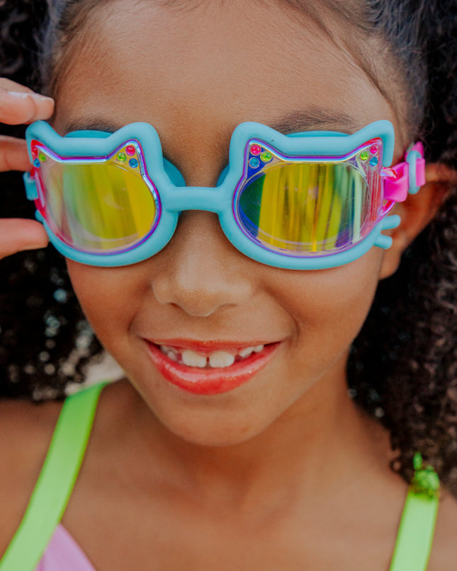 lifestyle of girl smiling wearing flexi feline blue all silicone swim goggles 