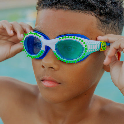 lifestyle of kid wearing jurassic dive in seafoam spike showing silicone spike and reptilian printed frame detail with eye ball slider