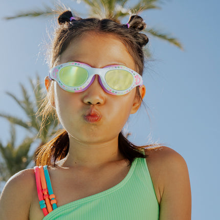 lifestyle of girl making kissy face wearing love sparkles in passion purple showing rhinestones and bubblegum pink heart printed on the frame