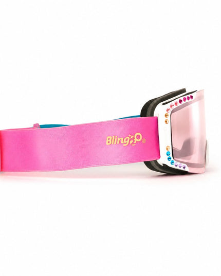 side product shot of powder pop kids' ski goggles in prism powder showing pink mirrored lens and rainbow rhinestones around white frame and hot pink strap