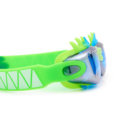 close-up view of draco the dragon kids' swim goggles in sea dragon green showing silicone spiked gasket and sharp teeth printed lens