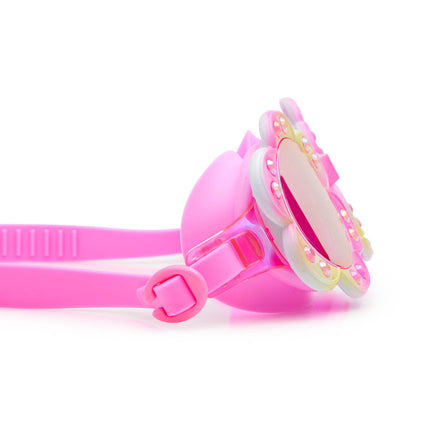 close-up view of gardenia flower shaped swim goggles in golden hour showing petal details and rhinestones with mirrored lens
