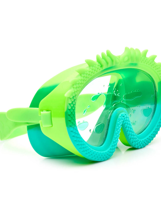 angled view of dragon kids' swim mask in green glider showing dragon textured silicone frame and floating green 'lava' in the double lens